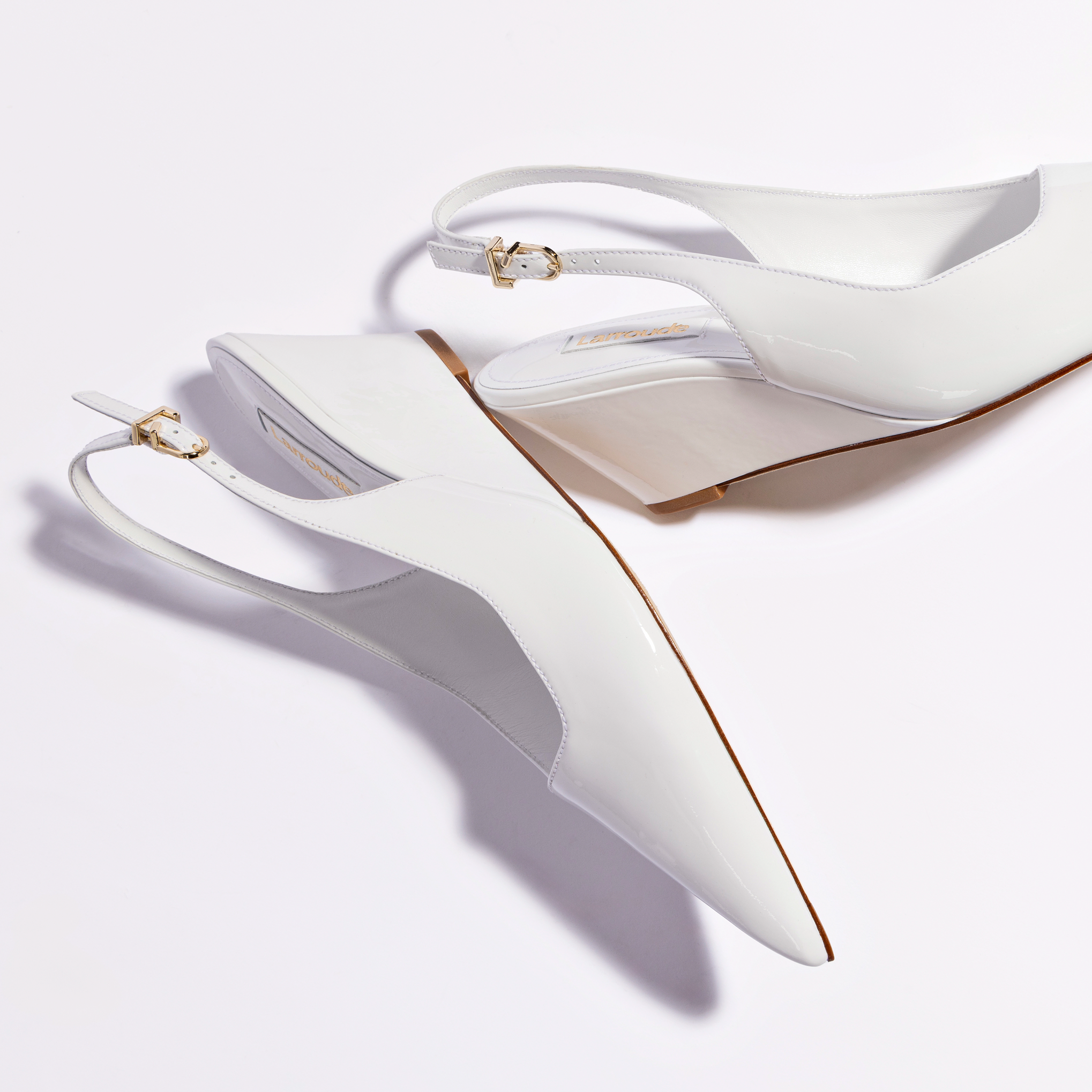 Loulou Pump In White Patent Leather